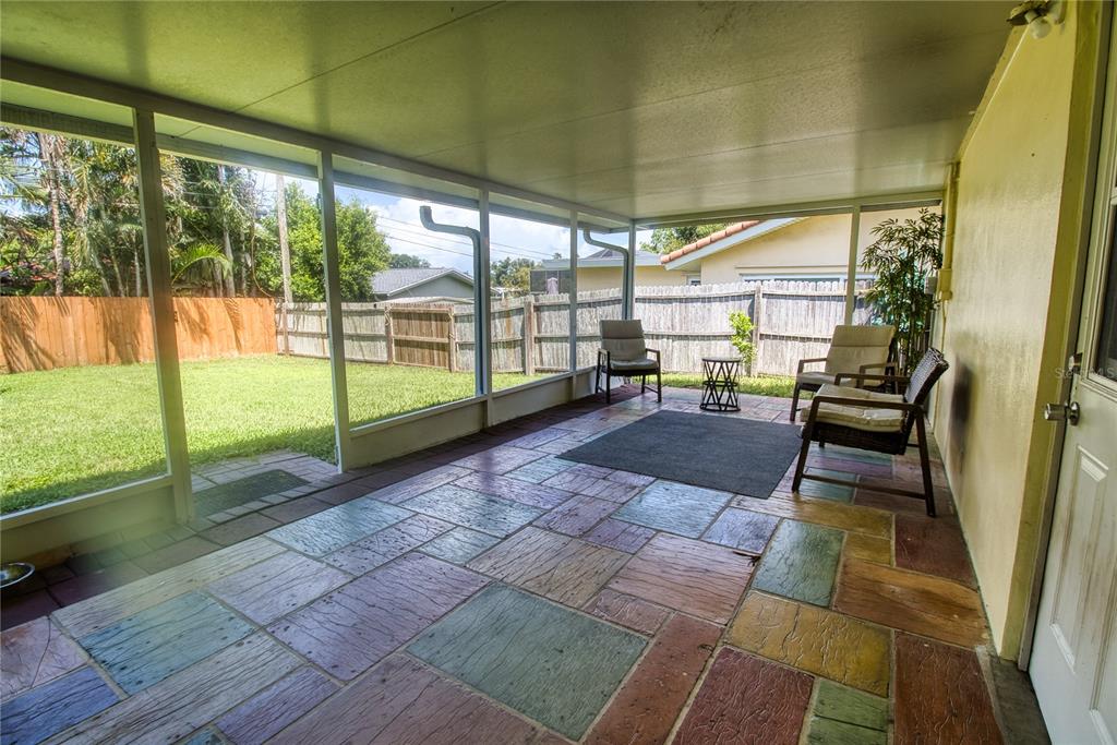 12784 137th Lane Largo, FL 33774 - Photo 13 of 14 a view of a porch with chairs and couches in the patio