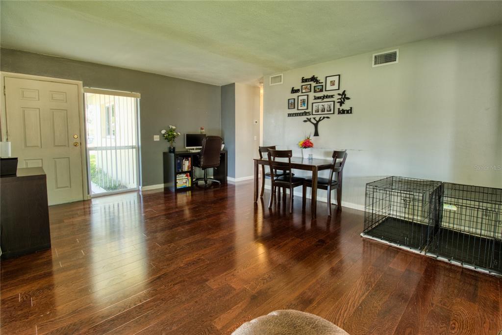 12784 137th Lane Largo, FL 33774 - Photo 7 of 14 a living room with furniture and wooden floor
