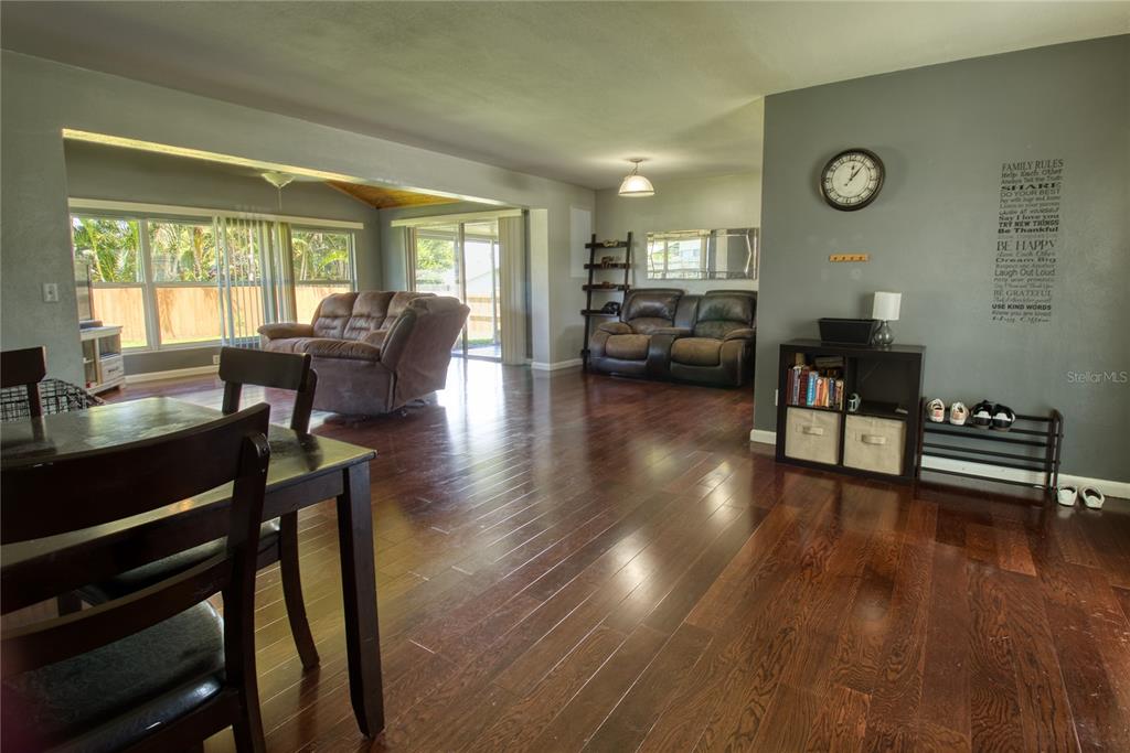 12784 137th Lane Largo, FL 33774 - Photo 8 of 14 a living room with furniture and a table
