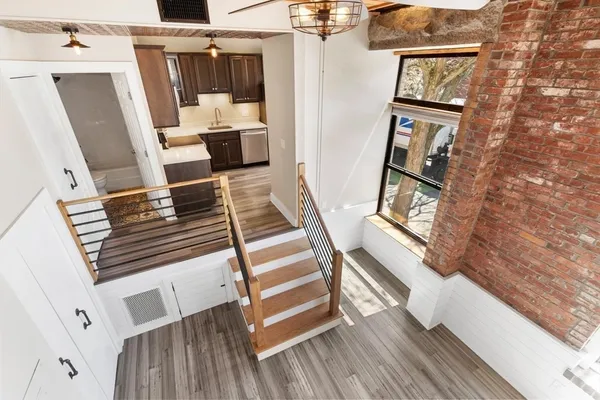 a view of living room and wooden floor