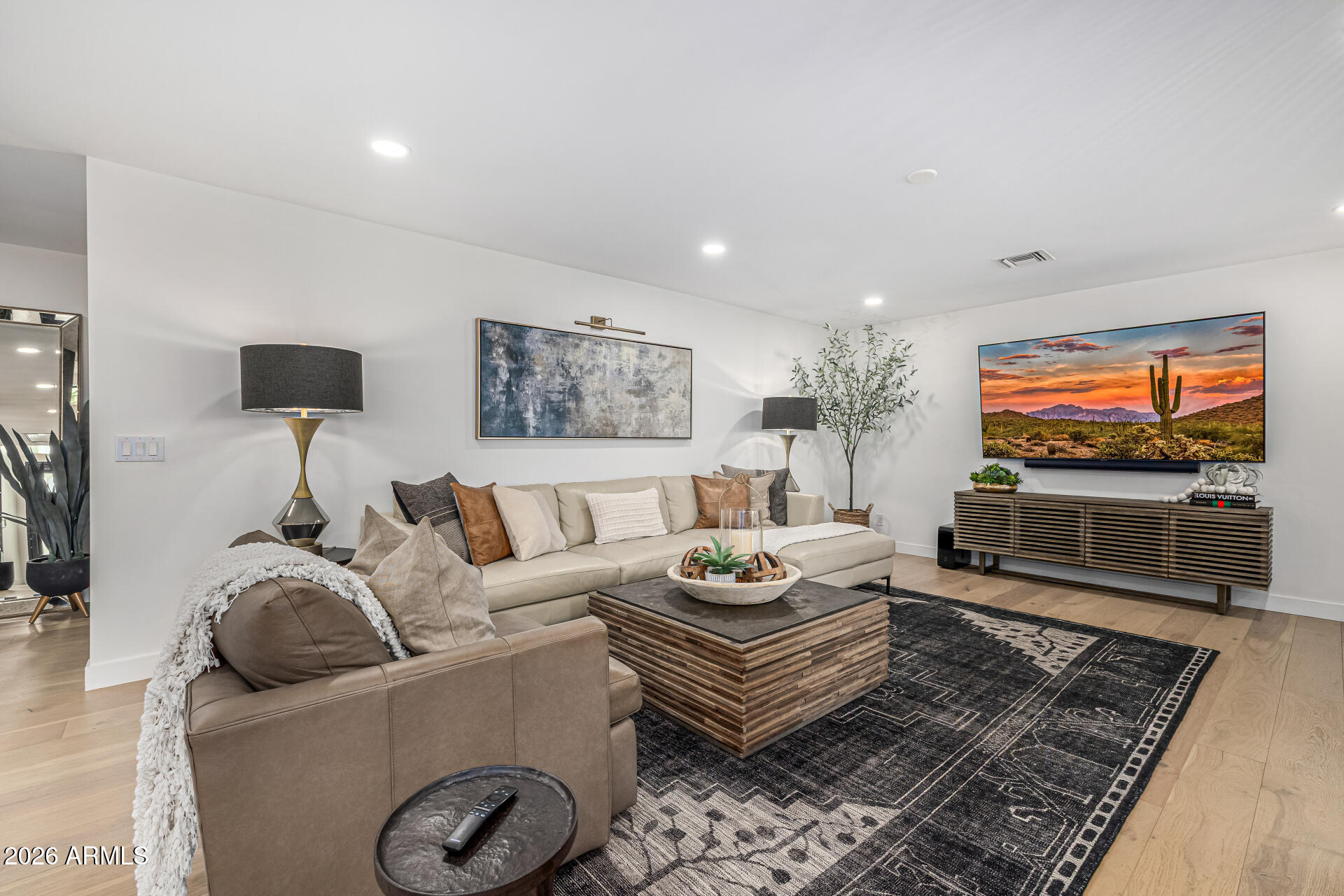 7770 East Camelback Road, Unit 11 Scottsdale, AZ 85251 - Photo 12 of 60 a living room with furniture and a flat screen tv