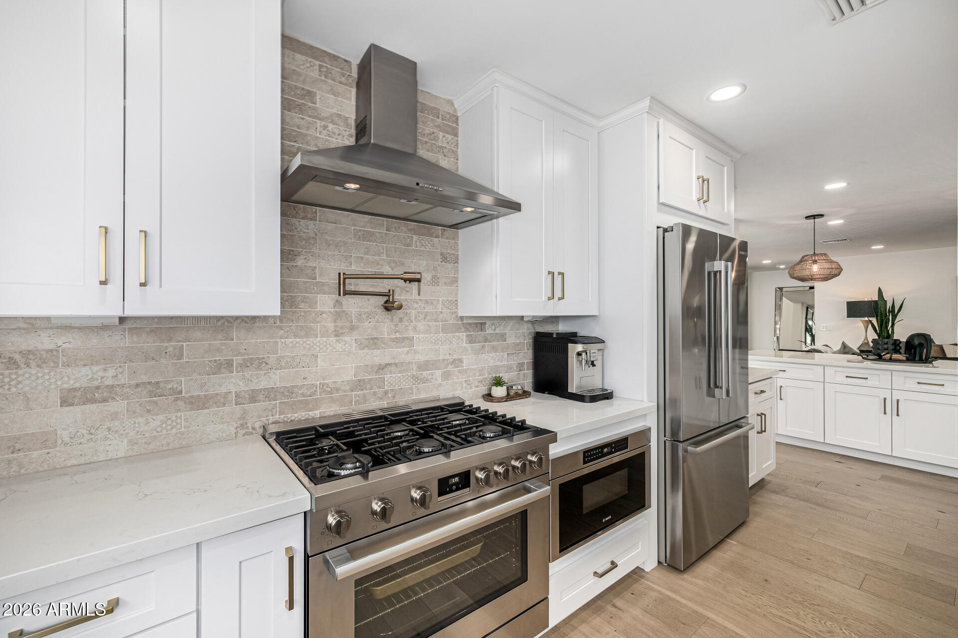7770 East Camelback Road, Unit 11 Scottsdale, AZ 85251 - Photo 19 of 60 a kitchen with stainless steel appliances granite countertop a stove a refrigerator and a granite counter tops