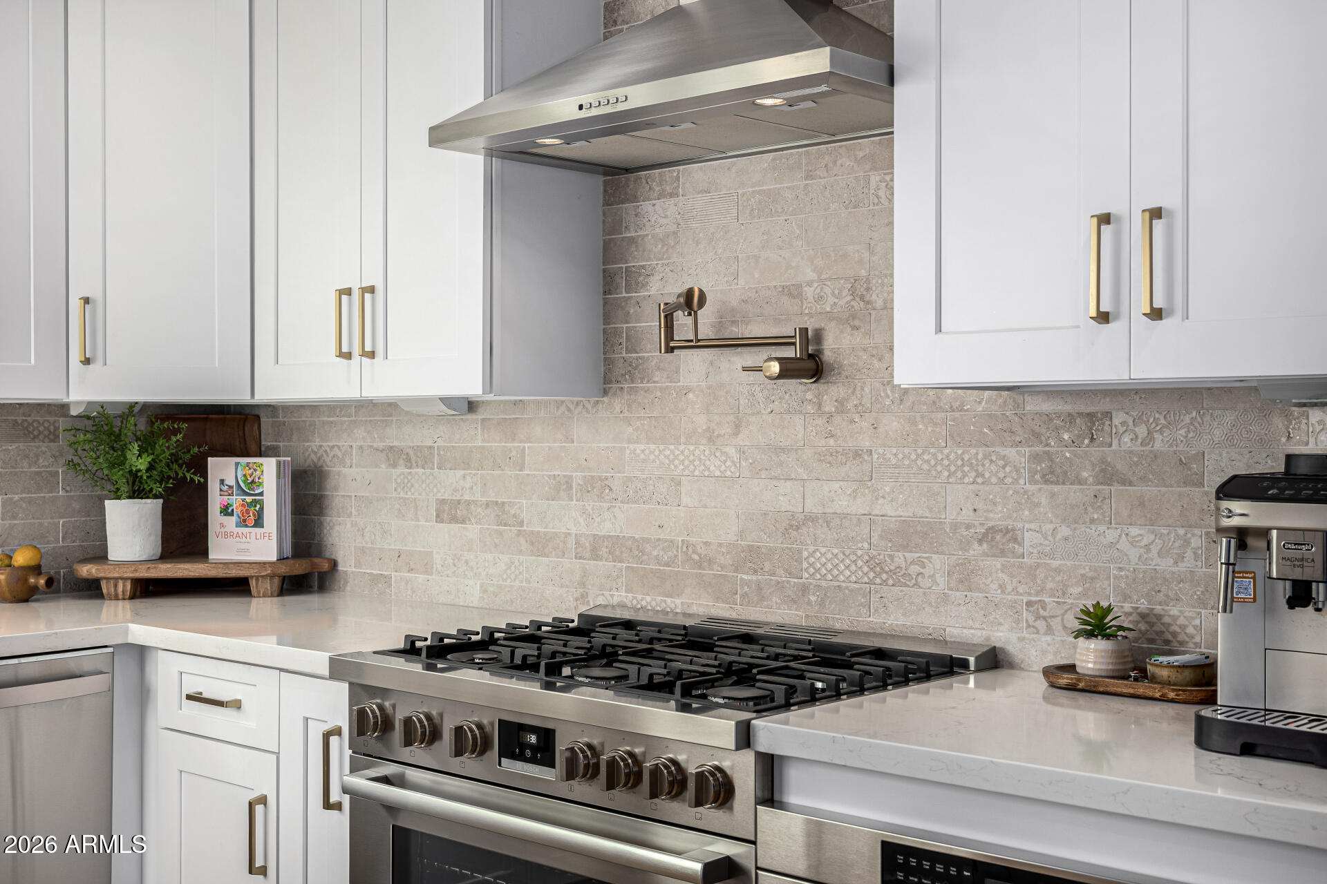 7770 East Camelback Road, Unit 11 Scottsdale, AZ 85251 - Photo 21 of 60 a kitchen with a stove and cabinets
