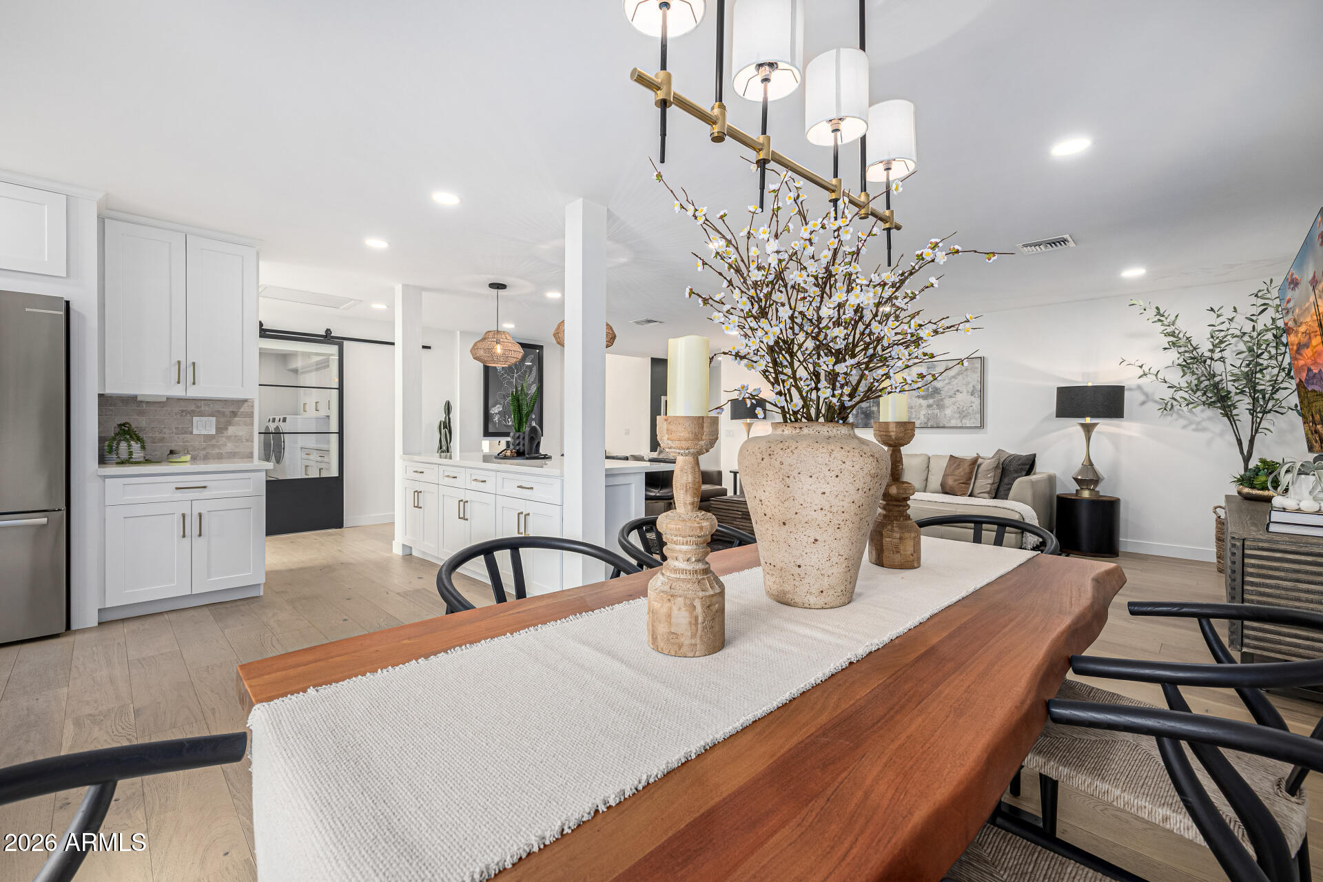 7770 East Camelback Road, Unit 11 Scottsdale, AZ 85251 - Photo 26 of 60 a dining room with furniture and wooden floor