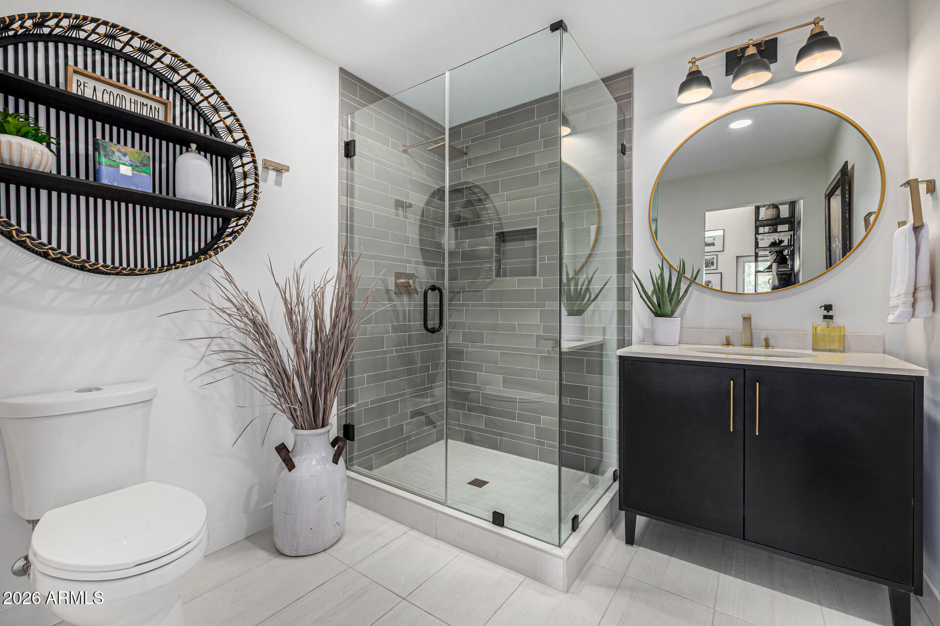 7770 East Camelback Road, Unit 11 Scottsdale, AZ 85251 - Photo 29 of 60 a bathroom with a toilet a sink and a mirror