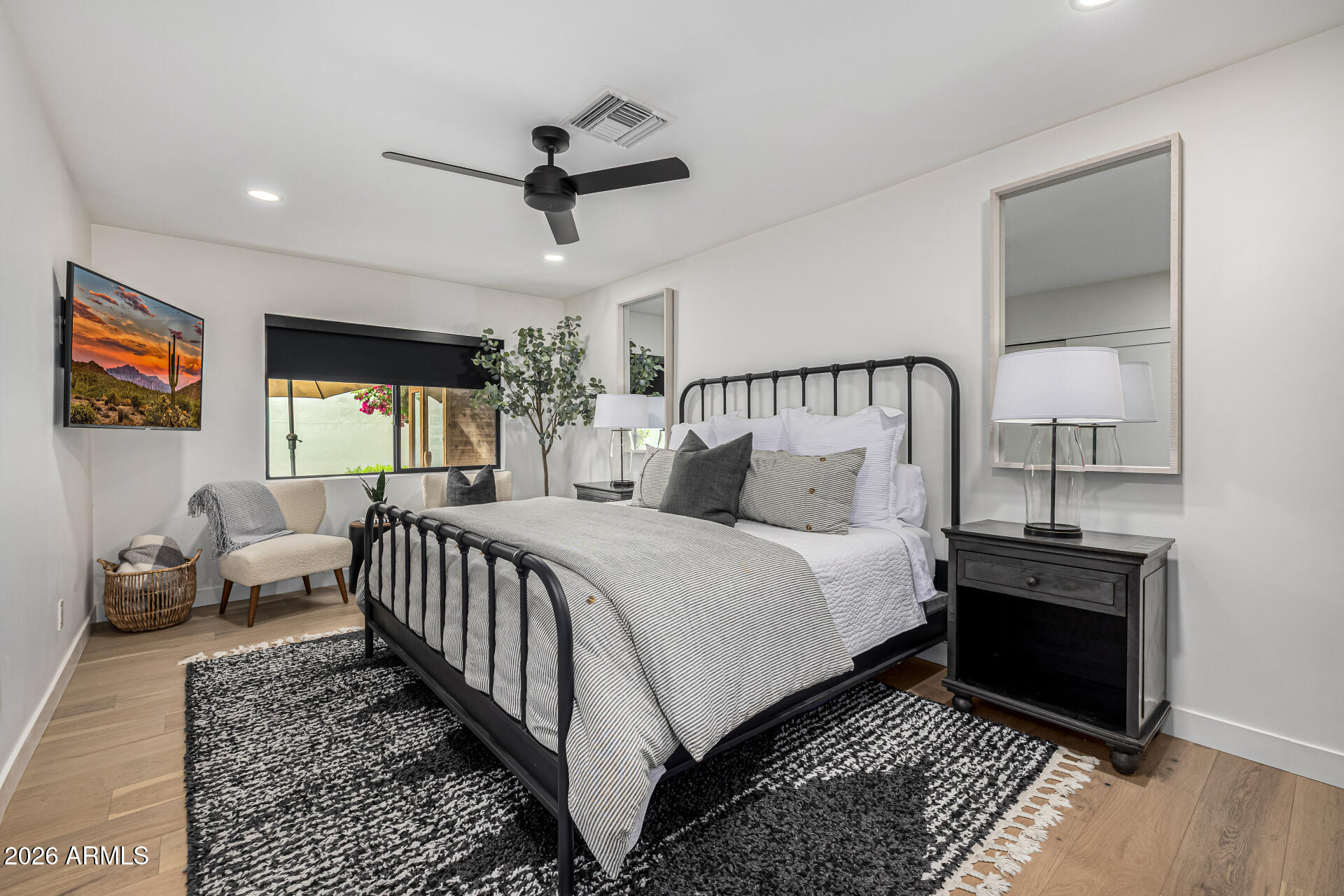 7770 East Camelback Road, Unit 11 Scottsdale, AZ 85251 - Photo 30 of 60 a bed room with a bed and a window