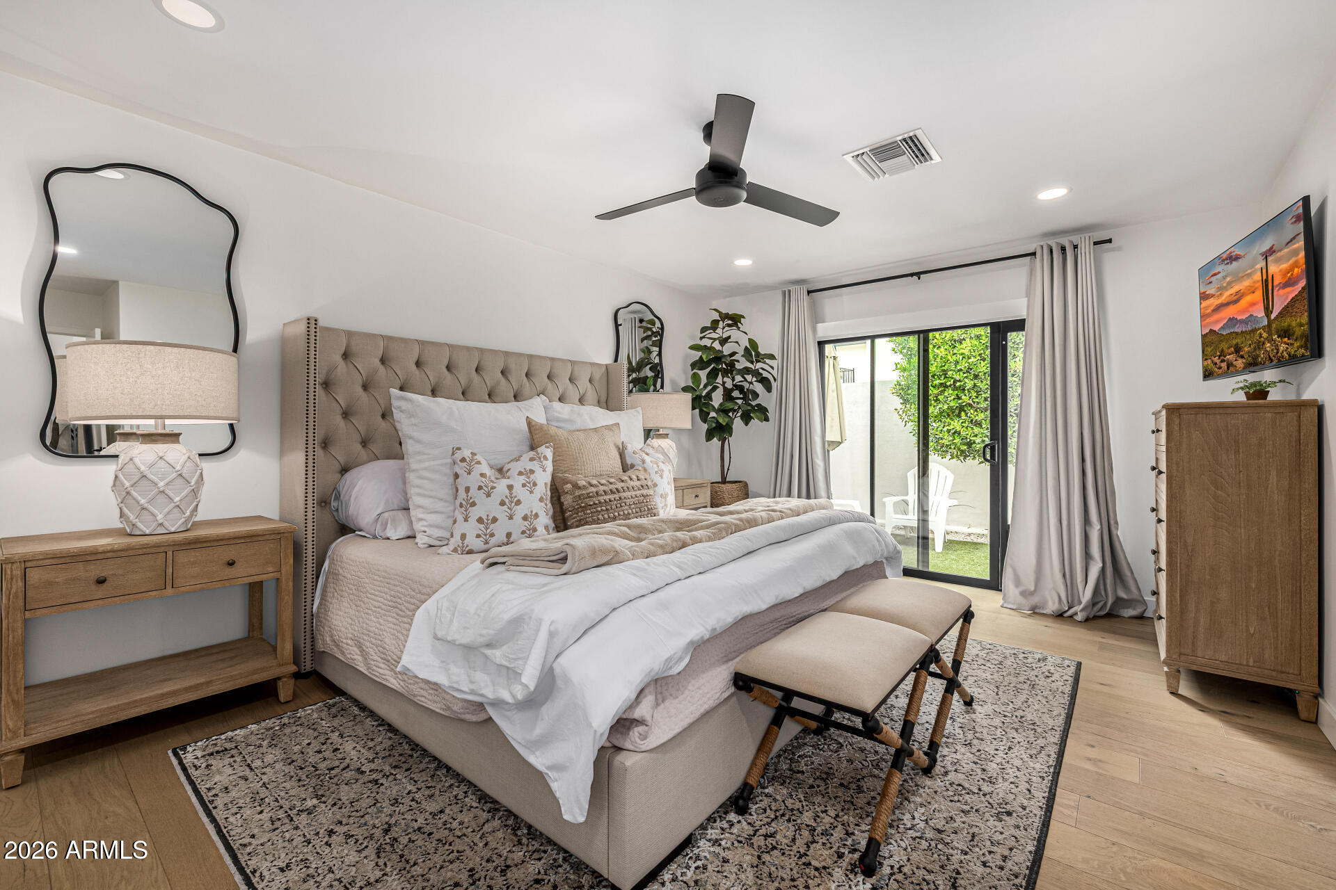 7770 East Camelback Road, Unit 11 Scottsdale, AZ 85251 - Photo 34 of 60 a bedroom with a bed a couch and dresser