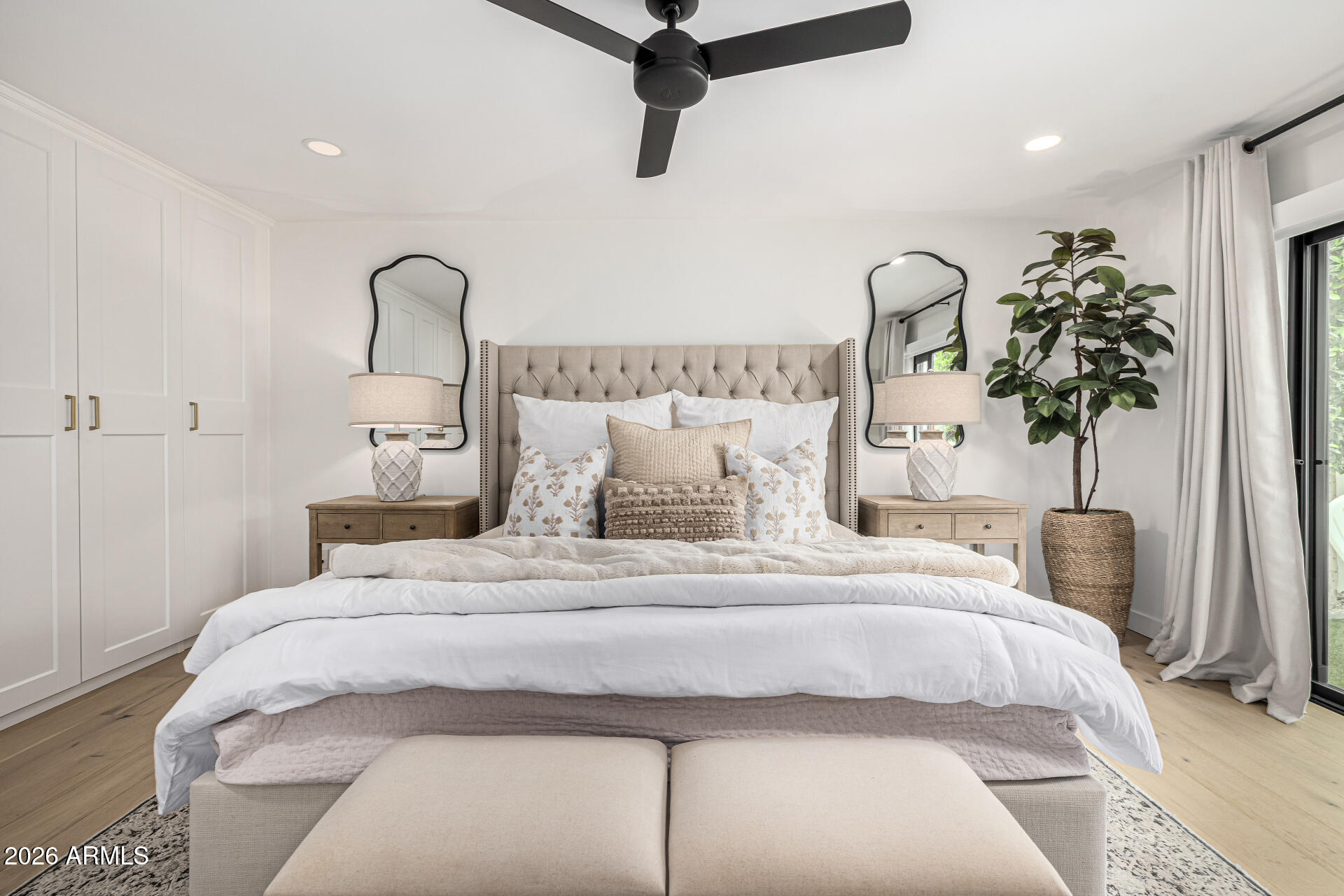 7770 East Camelback Road, Unit 11 Scottsdale, AZ 85251 - Photo 35 of 60 a bedroom with bed and a potted plant
