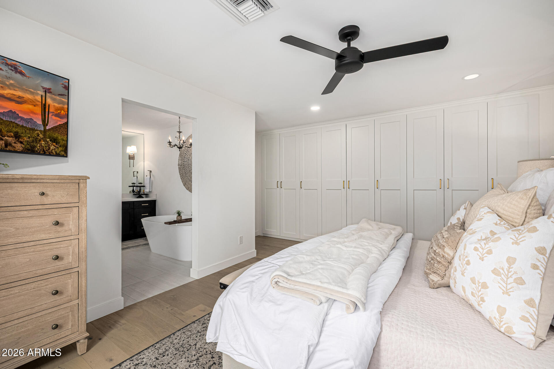 7770 East Camelback Road, Unit 11 Scottsdale, AZ 85251 - Photo 36 of 60 a bedroom with a bed and a flat screen tv