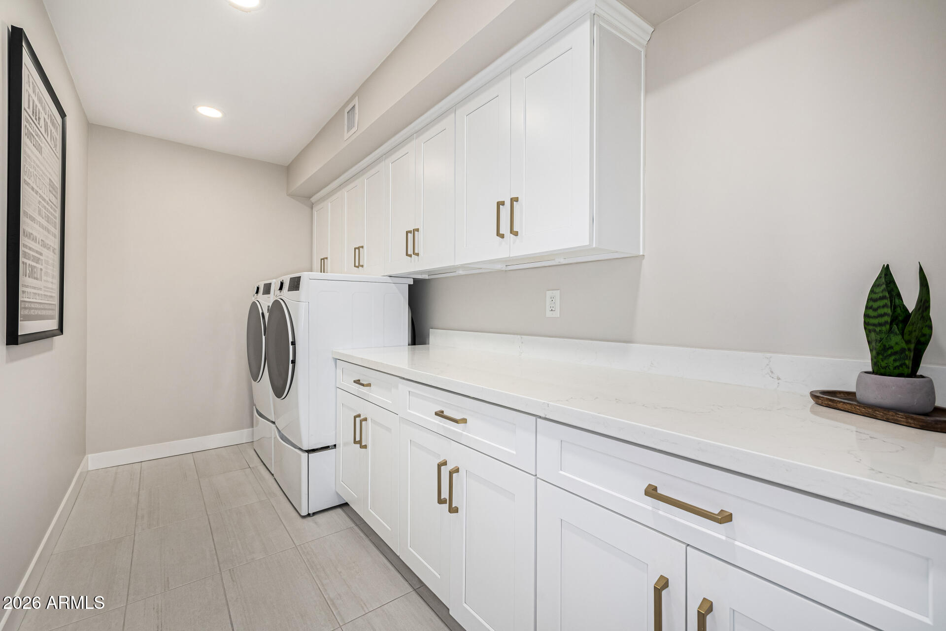 7770 East Camelback Road, Unit 11 Scottsdale, AZ 85251 - Photo 41 of 60 a kitchen with white cabinets and white appliances