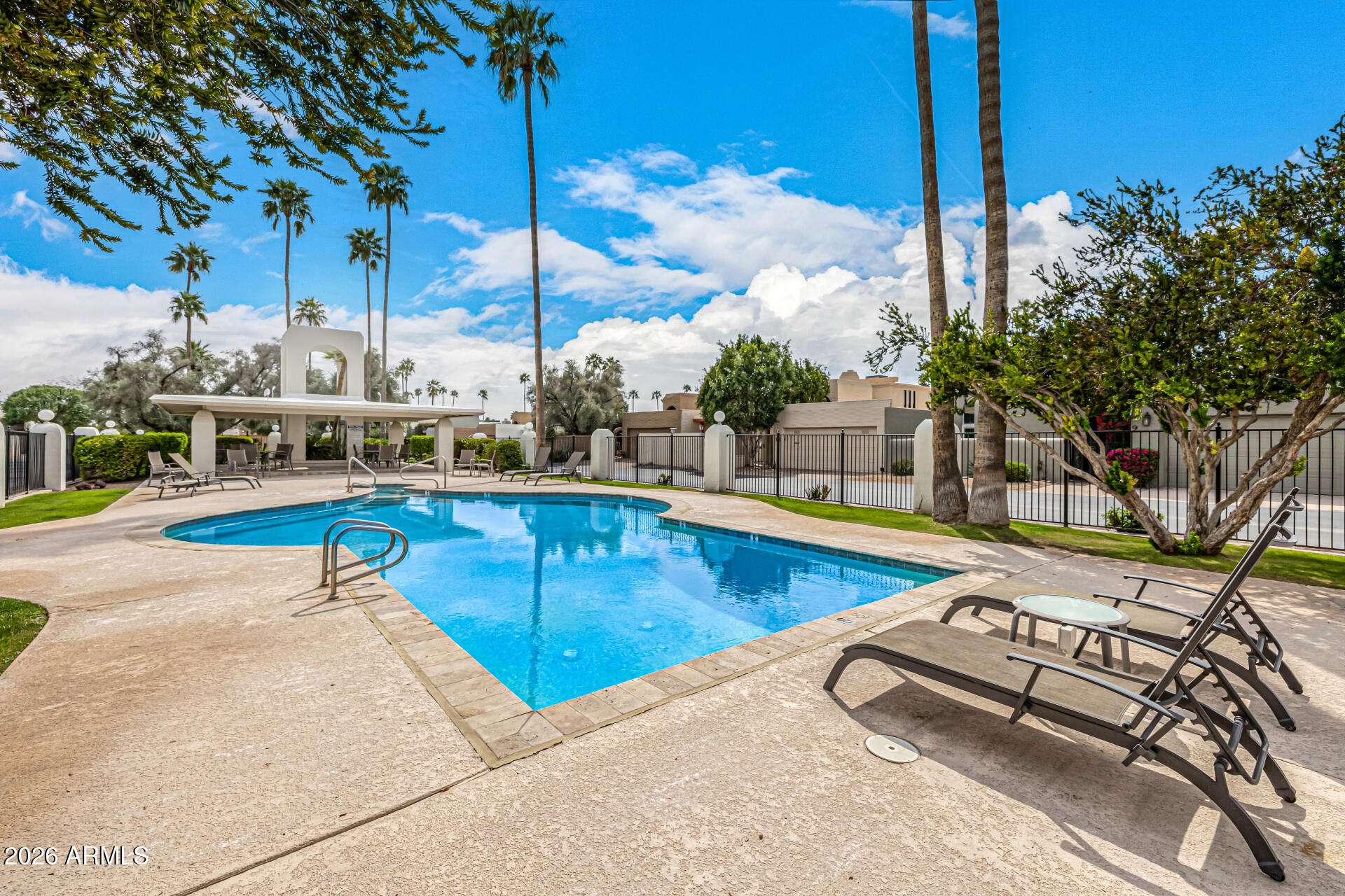 7770 East Camelback Road, Unit 11 Scottsdale, AZ 85251 - Photo 47 of 60 a view of swimming pool with chairs