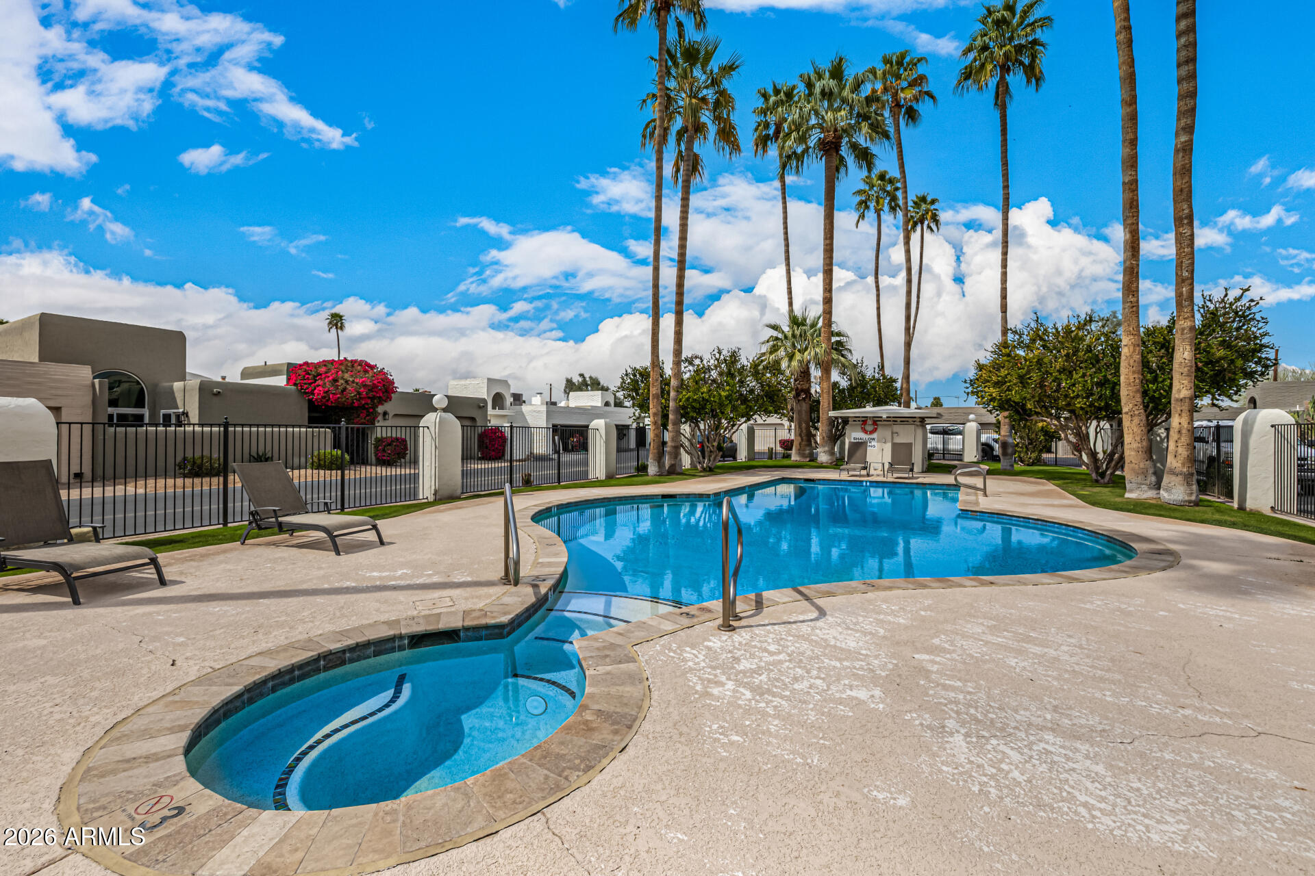7770 East Camelback Road, Unit 11 Scottsdale, AZ 85251 - Photo 49 of 60 a view of a swimming pool with a patio