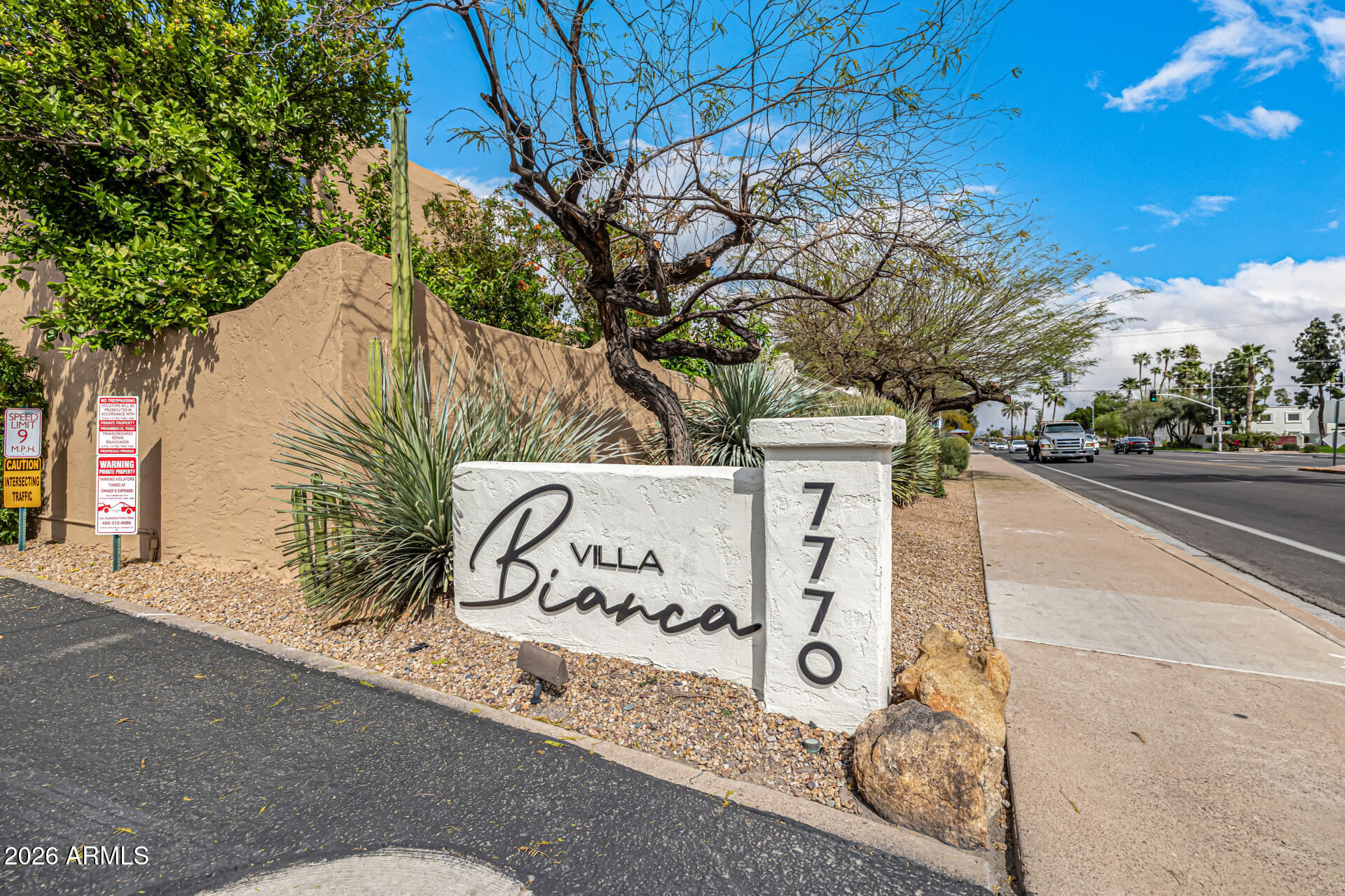 7770 East Camelback Road, Unit 11 Scottsdale, AZ 85251 - Photo 56 of 60 a sign that is on the side of a road
