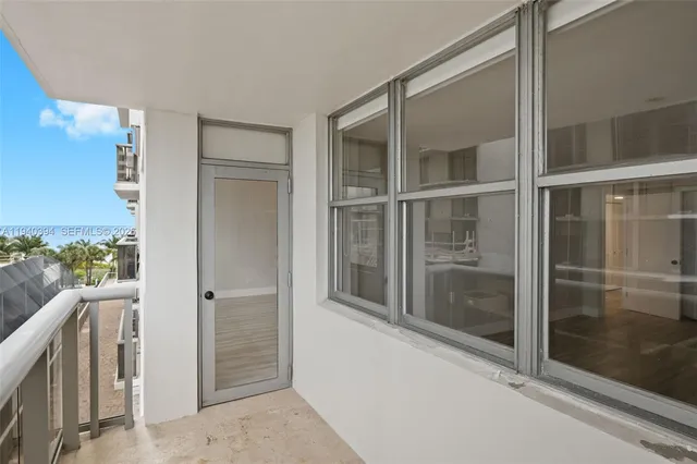 a view of a balcony with furniture