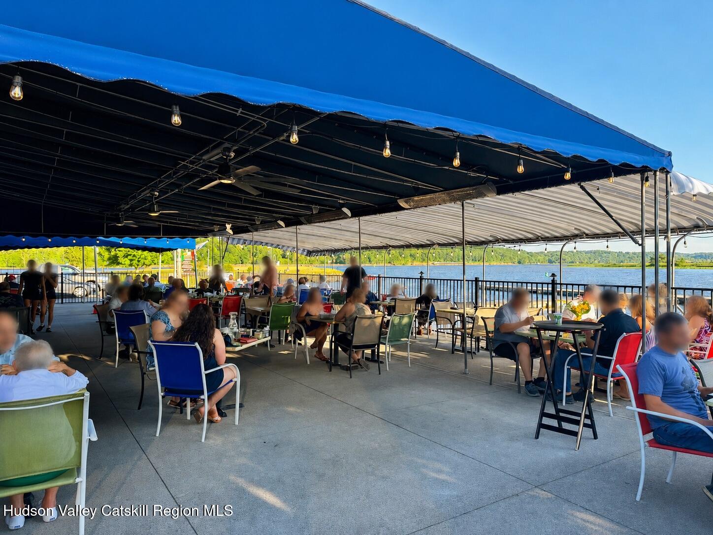 7 Main Street Catskill, NY 12414 - Photo 9 of 40 a view of tables and chairs under an umbrella