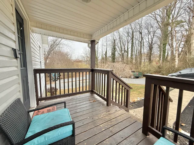 a balcony with wooden floor