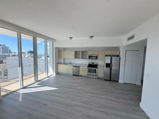 a room with furniture and a large window