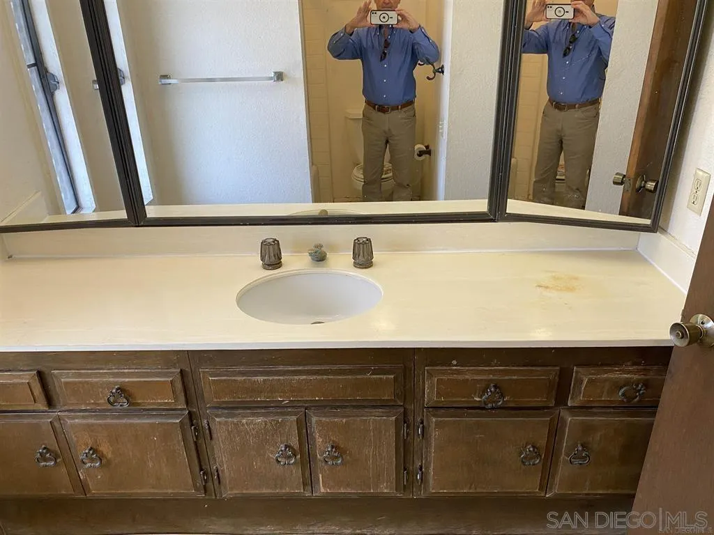 4940 Defiance Way San Diego, CA 92115 - Photo 13 of 47 a sink with a vanity