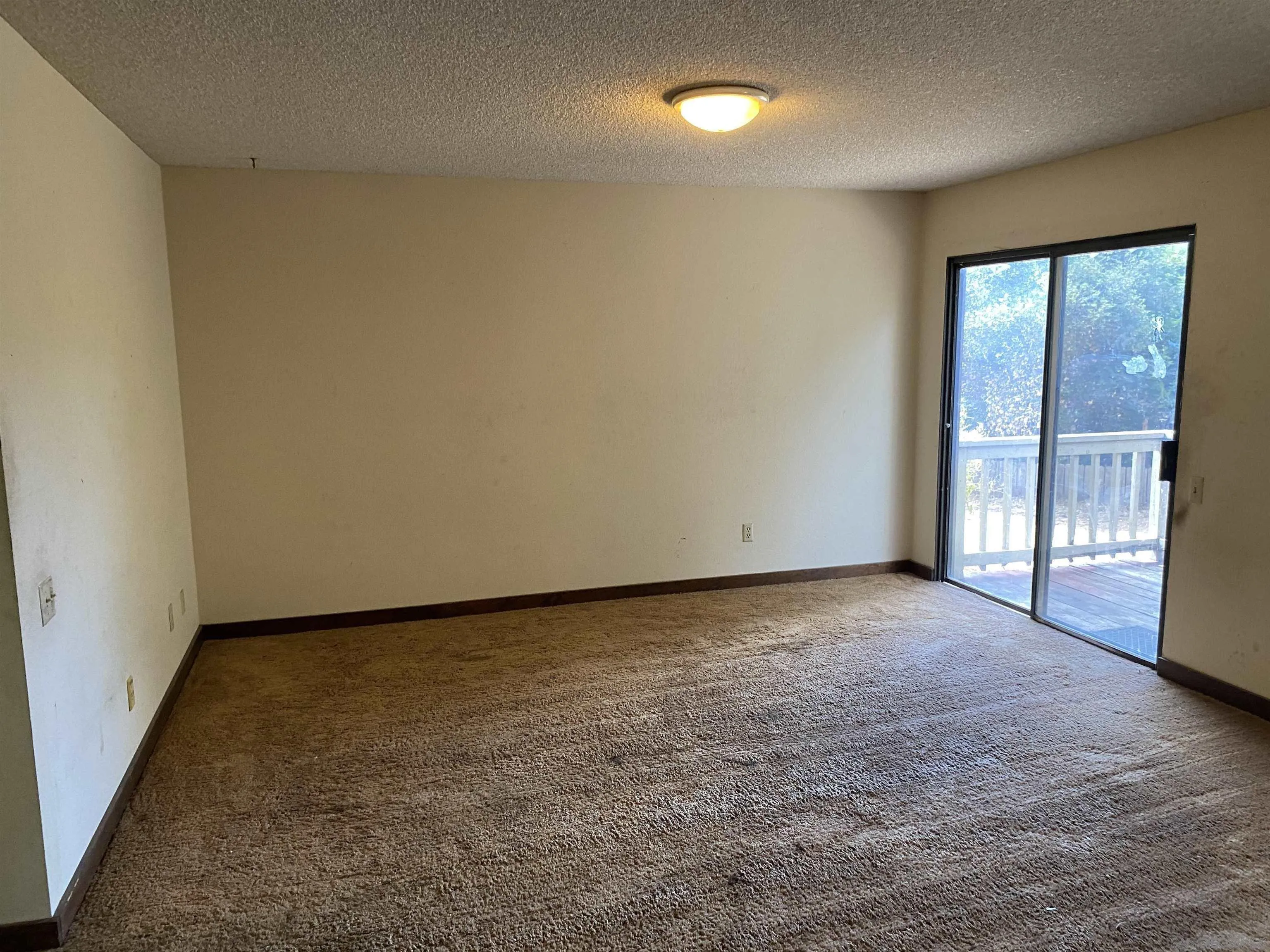 4940 Defiance Way San Diego, CA 92115 - Photo 31 of 47 an empty room with a fireplace