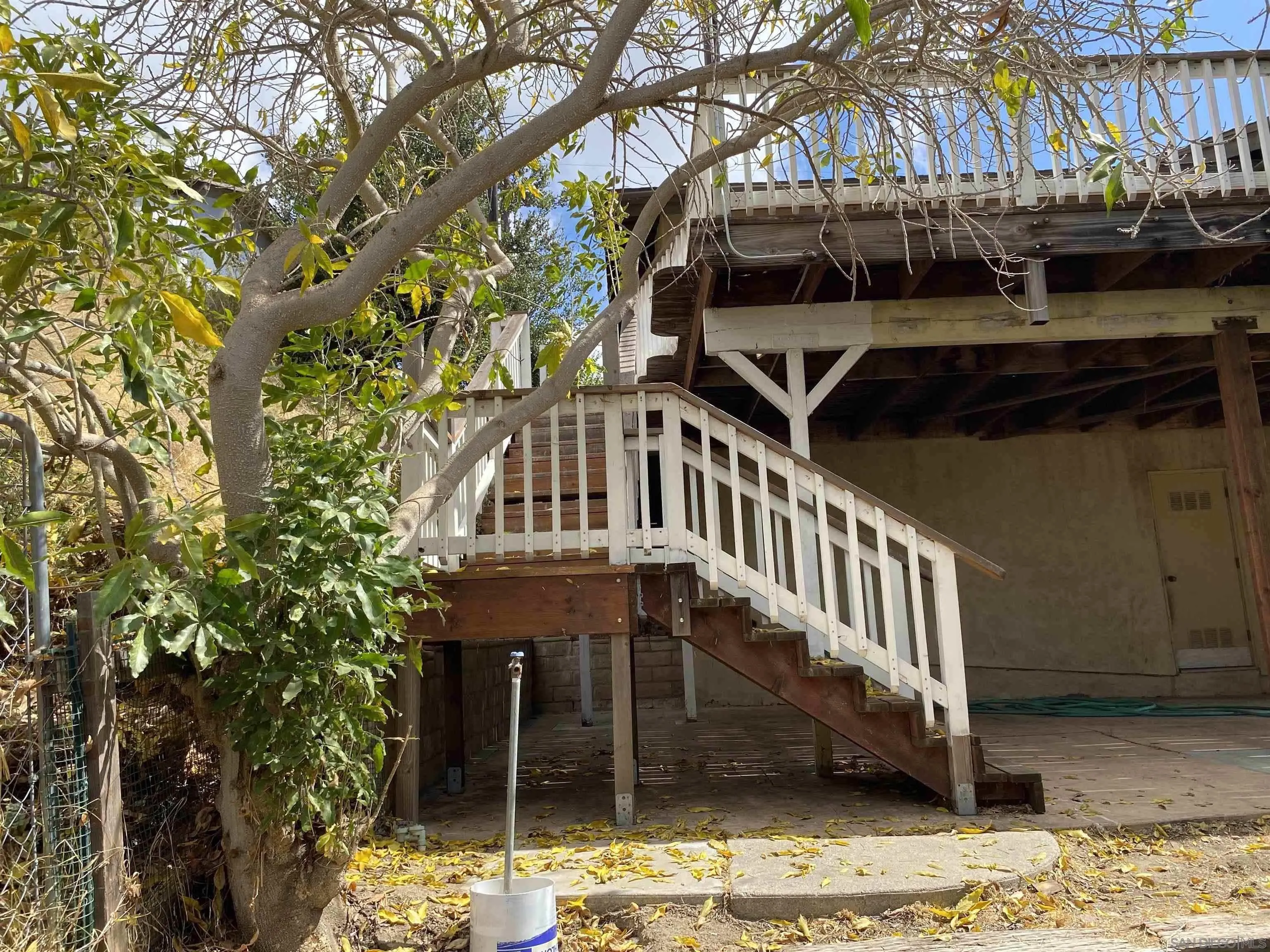 4940 Defiance Way San Diego, CA 92115 - Photo 37 of 47 a view of a house with a yard