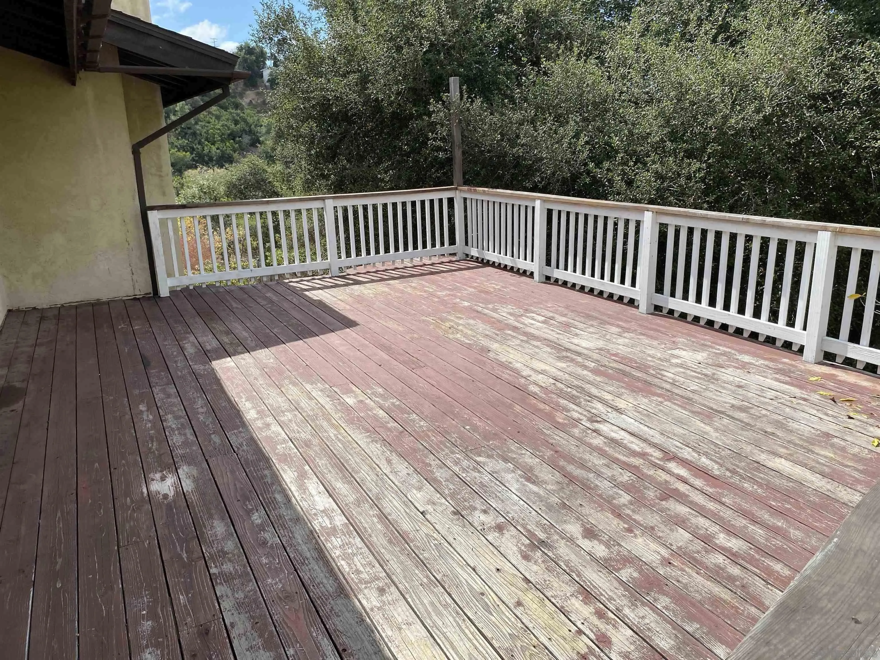 4940 Defiance Way San Diego, CA 92115 - Photo 39 of 47 a balcony with wooden floor
