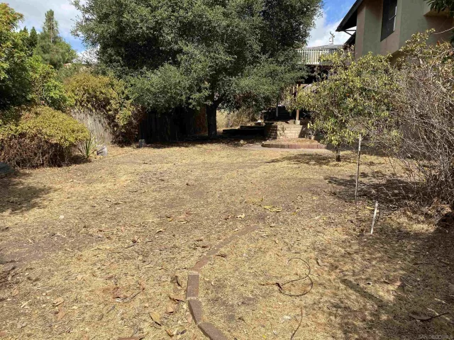 a view of balcony with wooden floor