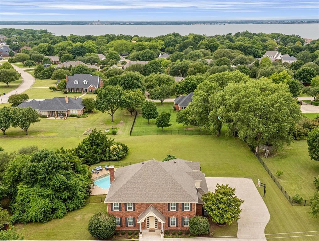 506 Meadowview Road Heath, TX 75032 - Photo 29 of 32 an aerial view of a house with a garden and lake view