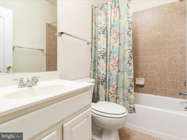 a bathroom with a sink a toilet and a bathtub