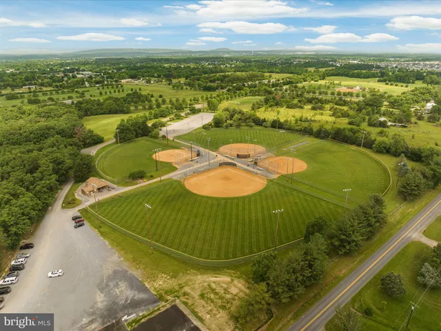 a view of a big yard with an trees