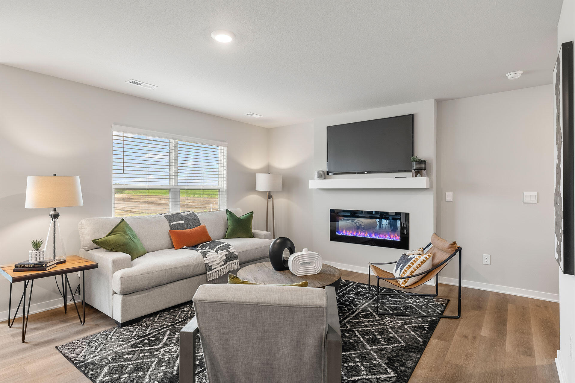 600 West 39th Place Hobart, IN 46342 - Photo 5 of 17 a living room with furniture a flat screen tv and a fireplace