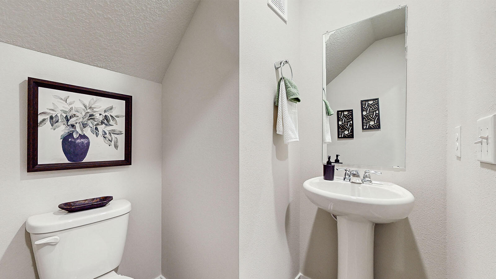 600 West 39th Place Hobart, IN 46342 - Photo 7 of 17 a bathroom with a toilet sink and mirror