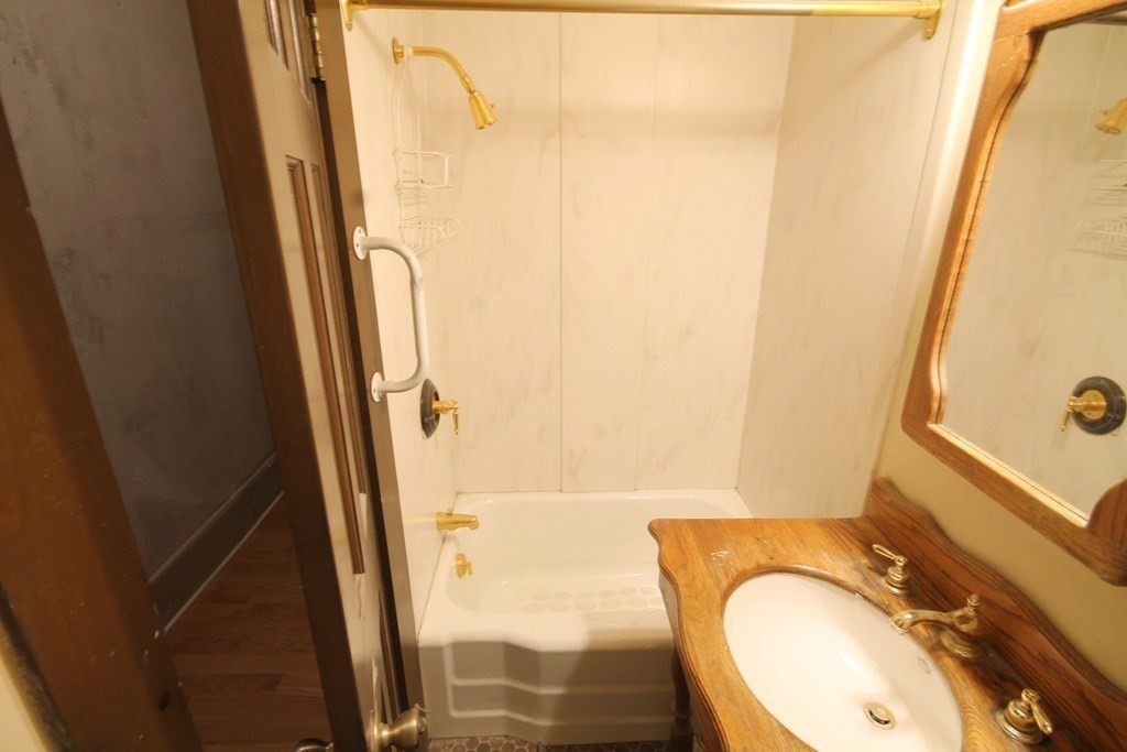 52 Mattoon Street Springfield, MA 01105 - Photo 27 of 29 a bathroom with a sink and a mirror