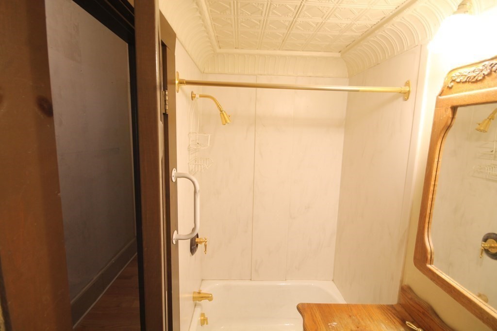 52 Mattoon Street Springfield, MA 01105 - Photo 28 of 29 a bathroom with a shower and a tub