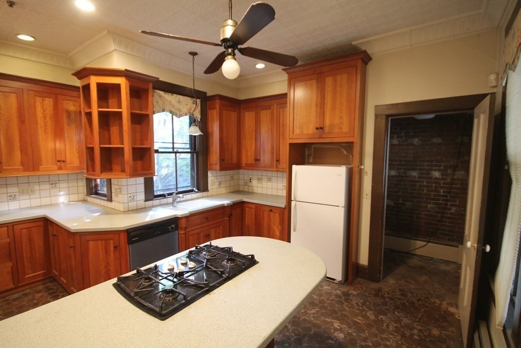 52 Mattoon Street Springfield, MA 01105 - Photo 3 of 29 a kitchen with stainless steel appliances granite countertop a sink stove and refrigerator