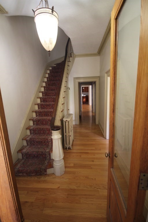 52 Mattoon Street Springfield, MA 01105 - Photo 4 of 29 a view of entryway and hall with wooden floor