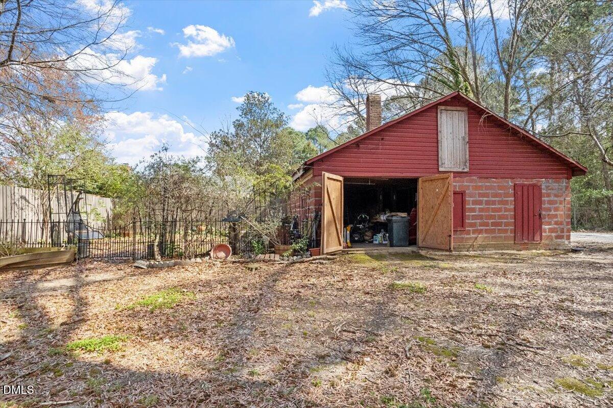 3107 Dixon Road Durham, NC 27707 - Photo 12 of 12 a front view of a house with a yard and garage