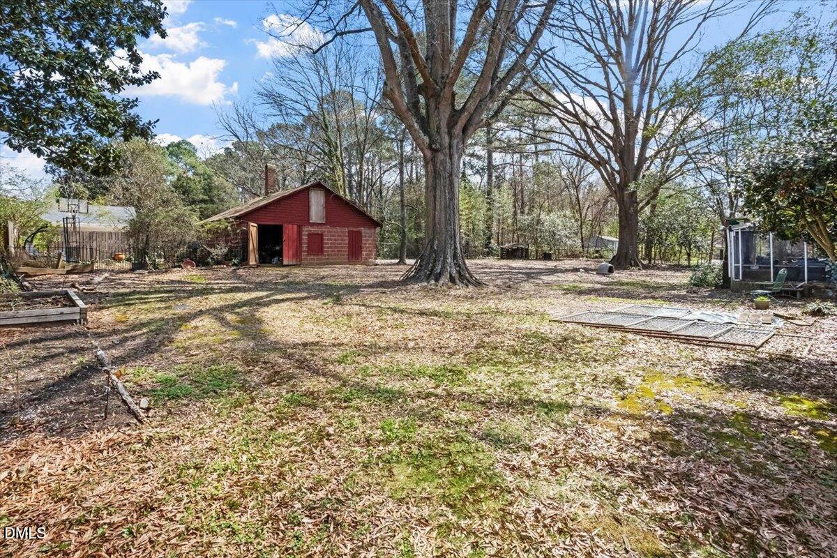 3107 Dixon Road Durham, NC 27707 - Photo 7 of 12 a big room with trees in the background