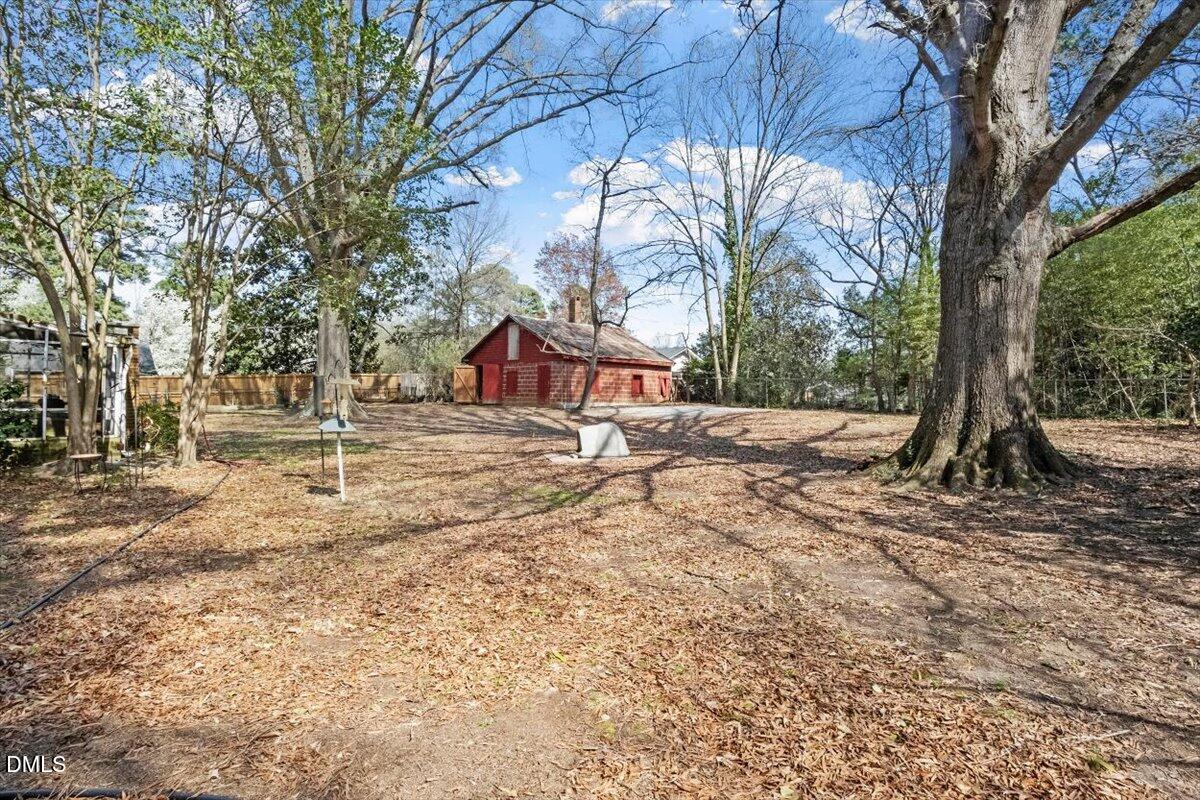 3107 Dixon Road Durham, NC 27707 - Photo 10 of 12 a house with trees in front of it