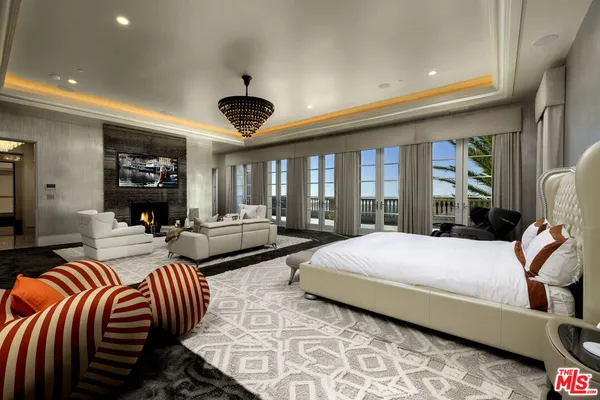 a bedroom with double bed and a large window