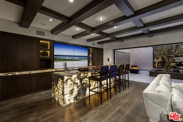 a view of a livingroom with furniture and a table