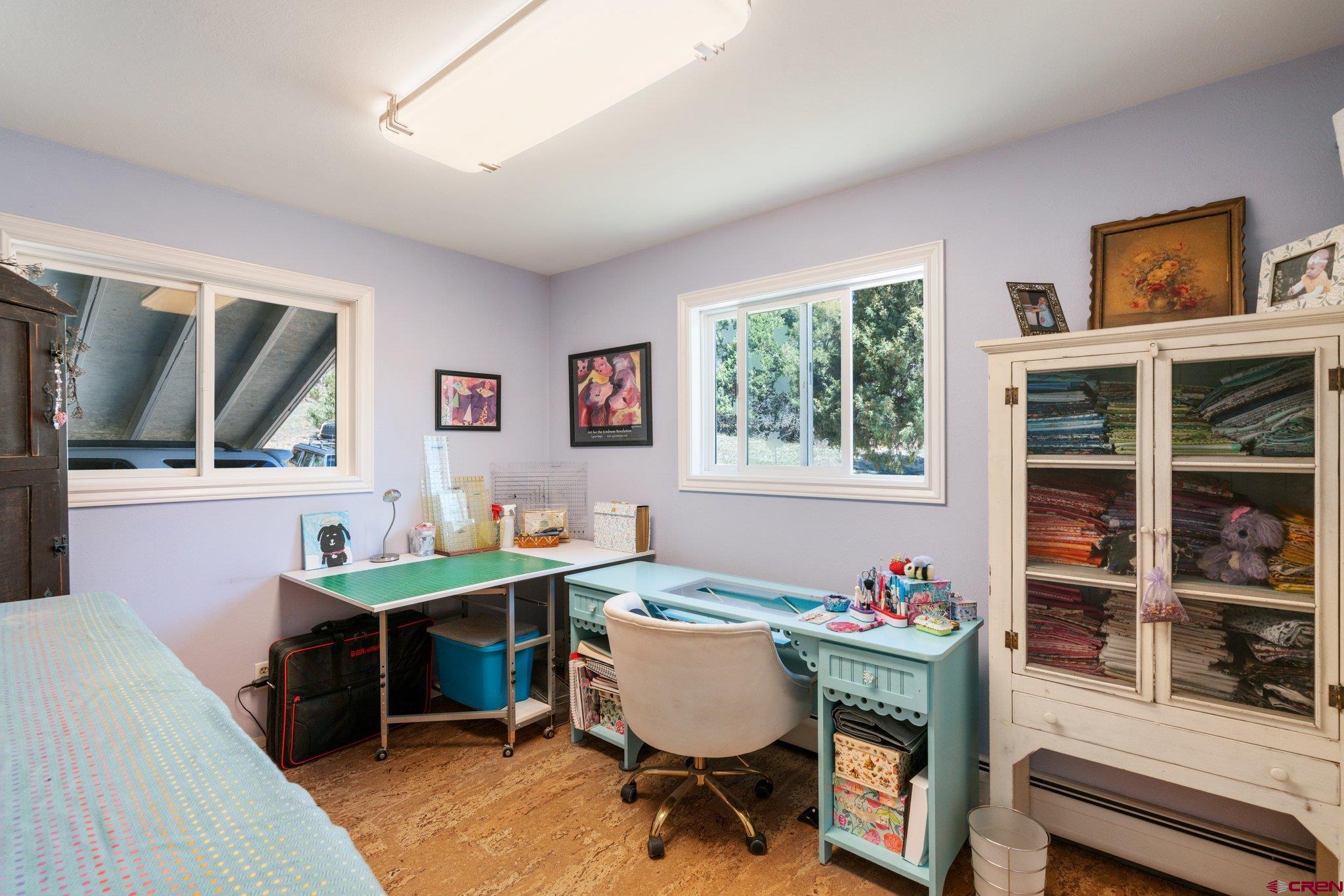 145 N Road Durango, CO 81303 - Photo 16 of 35 a view of a workspace with furniture and a window