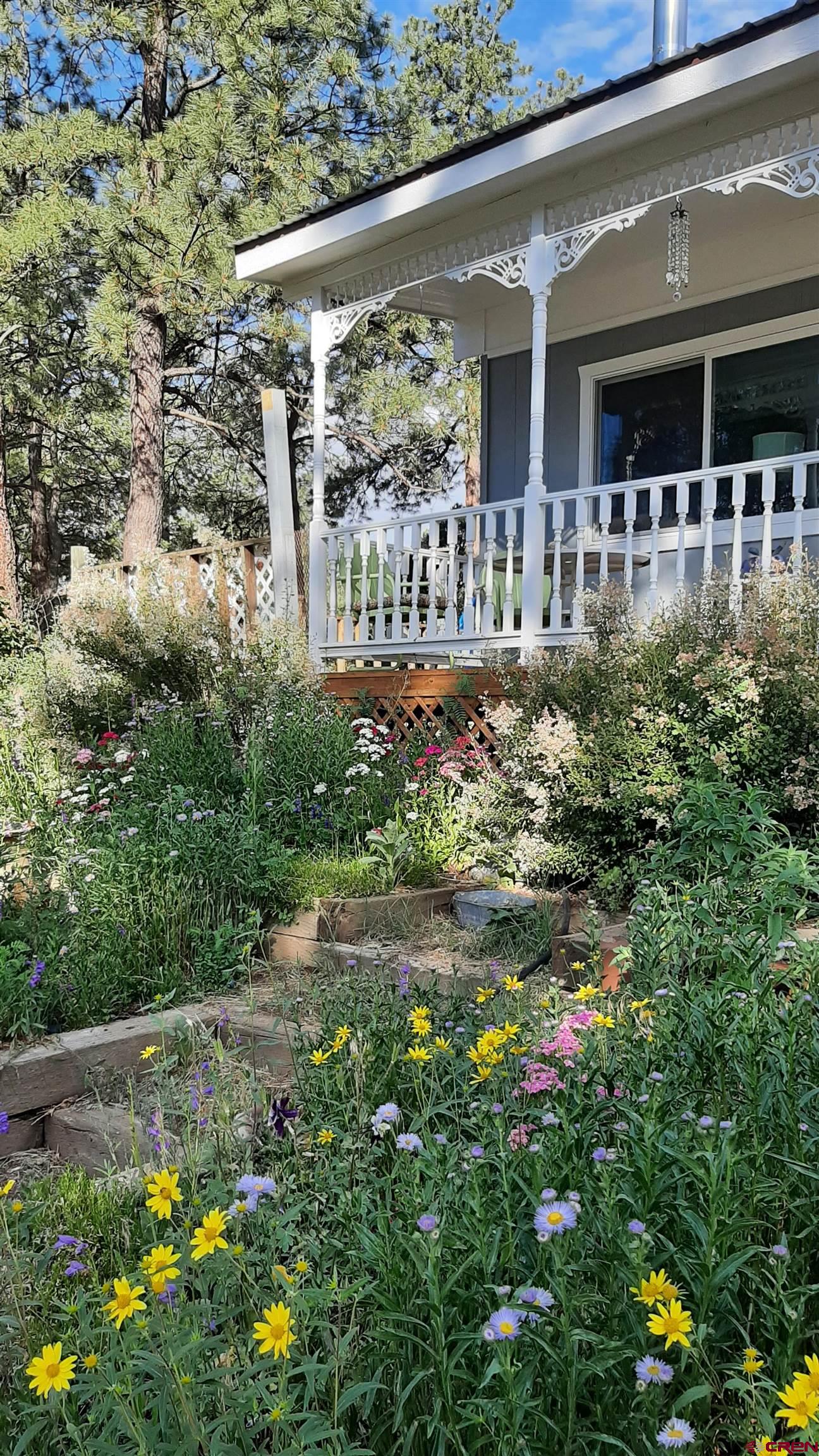 145 N Road Durango, CO 81303 - Photo 2 of 35 a front view of house with yard and green space