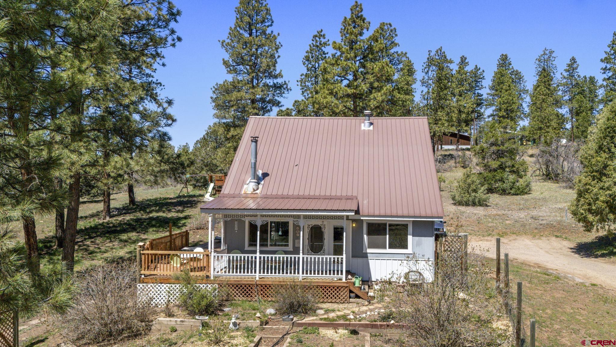 145 N Road Durango, CO 81303 - Photo 25 of 35 aerial view of a house with a yard and potted plants