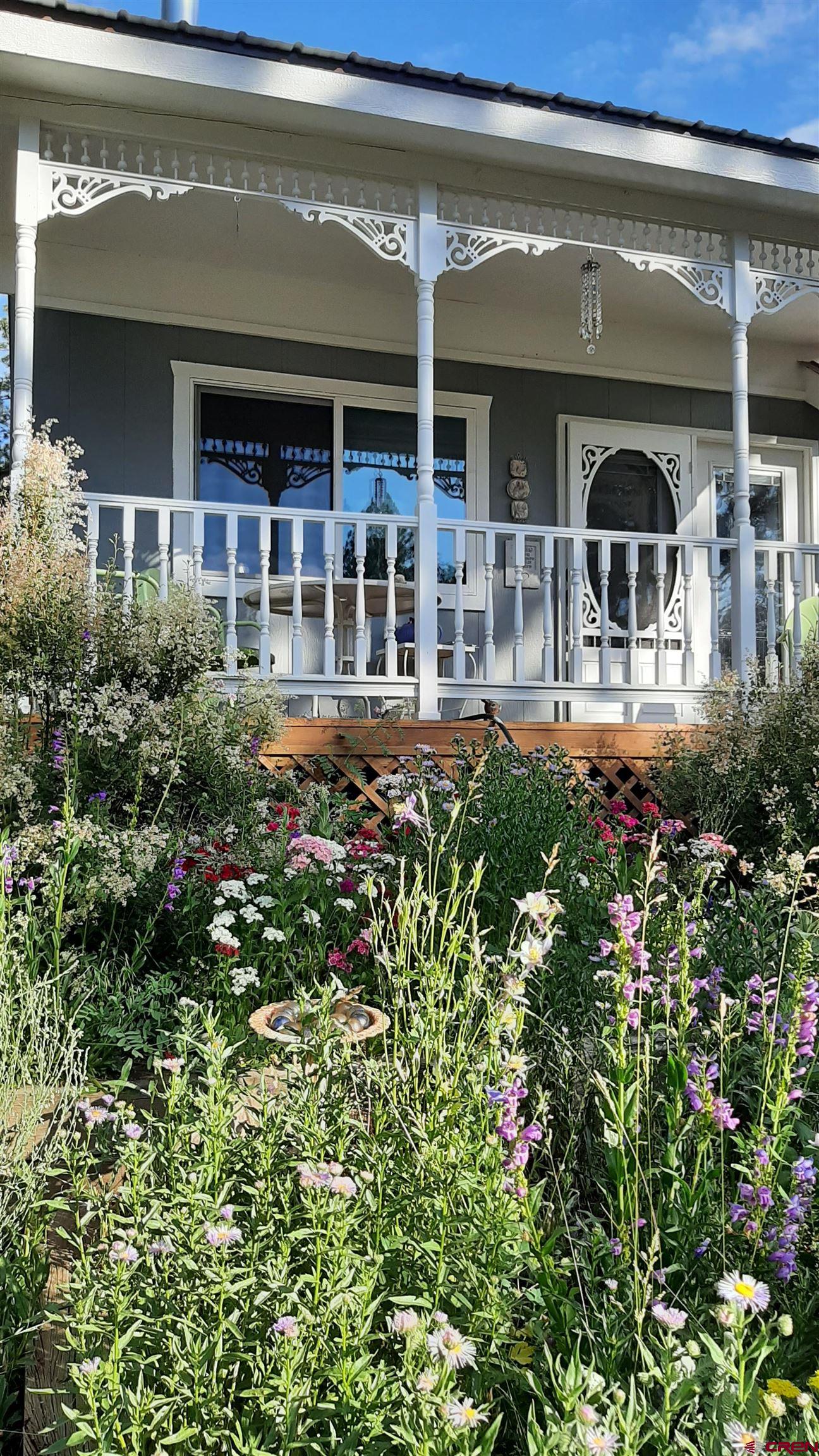 145 N Road Durango, CO 81303 - Photo 30 of 35 a front view of a house with plants