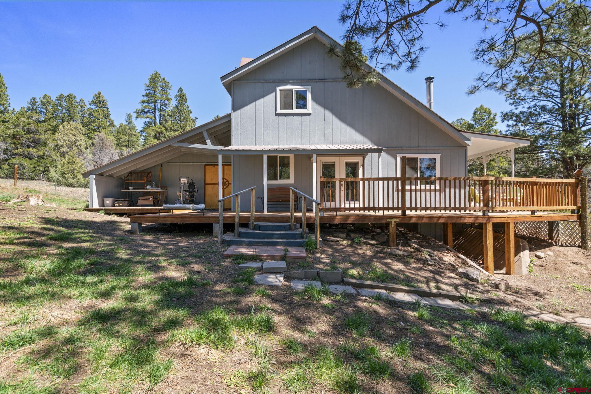 145 N Road Durango, CO 81303 - Photo 32 of 35 a front view of a house with a yard