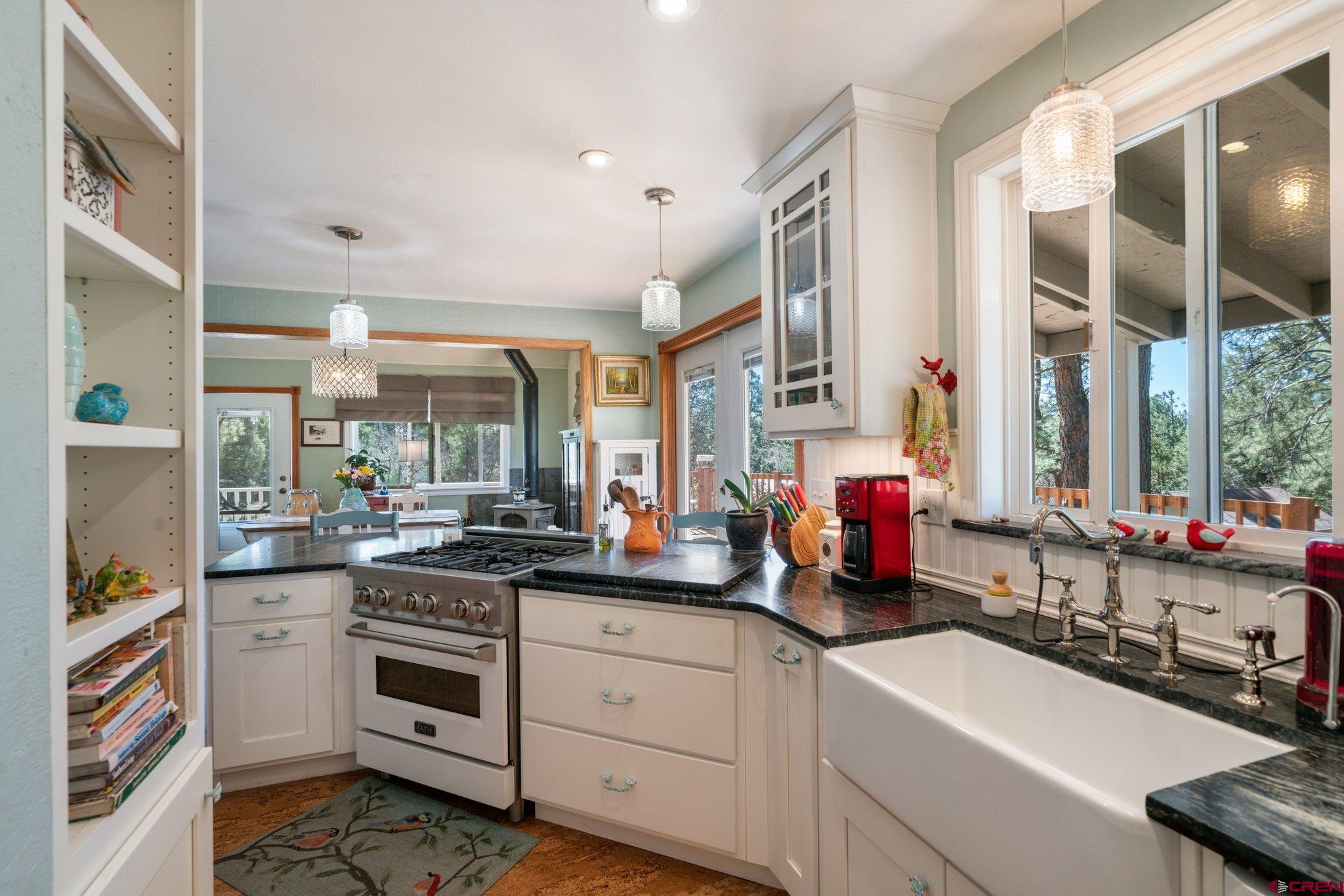 145 N Road Durango, CO 81303 - Photo 5 of 35 a kitchen with sink a stove and cabinets