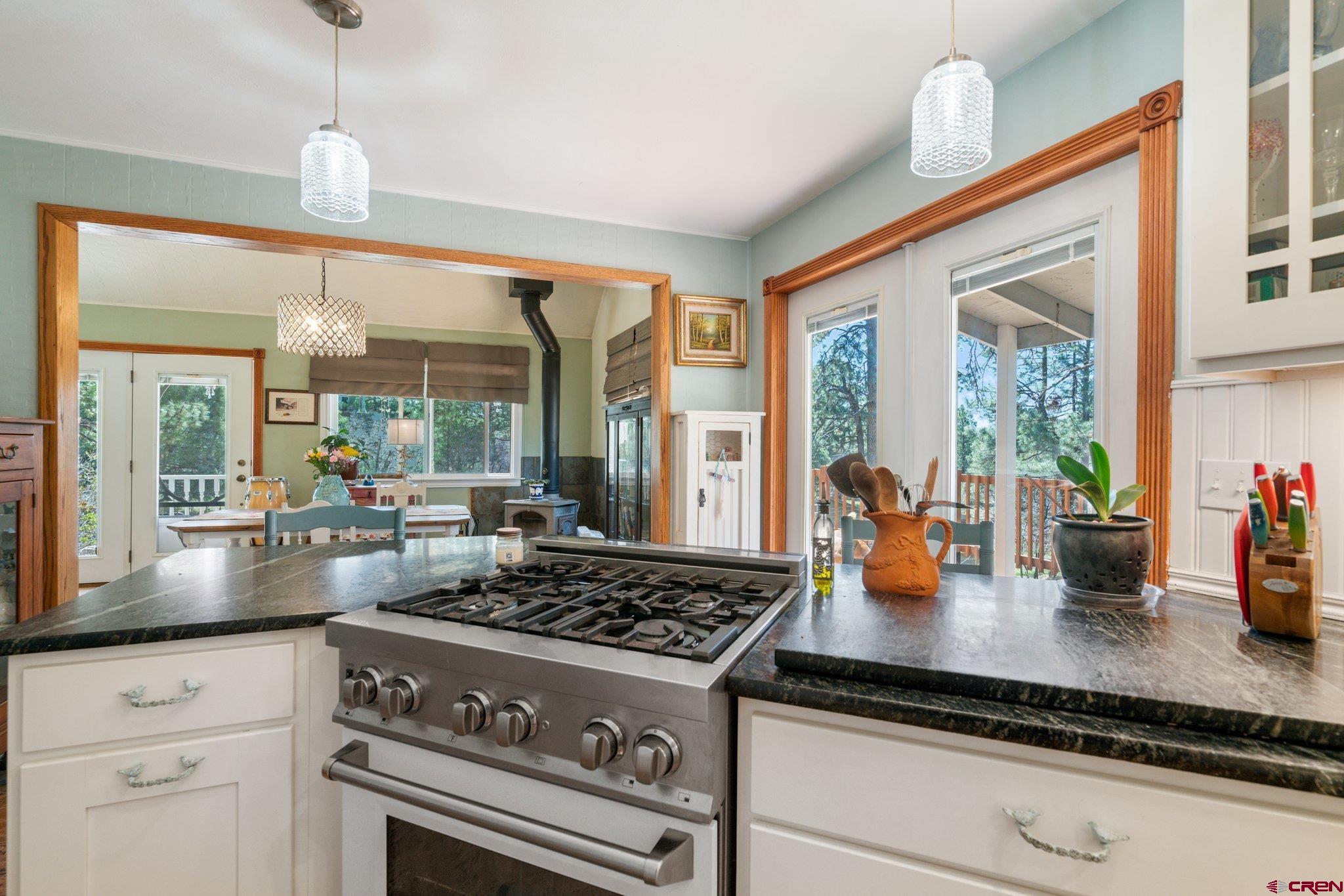 145 N Road Durango, CO 81303 - Photo 6 of 35 a kitchen with a stove dining table and chairs