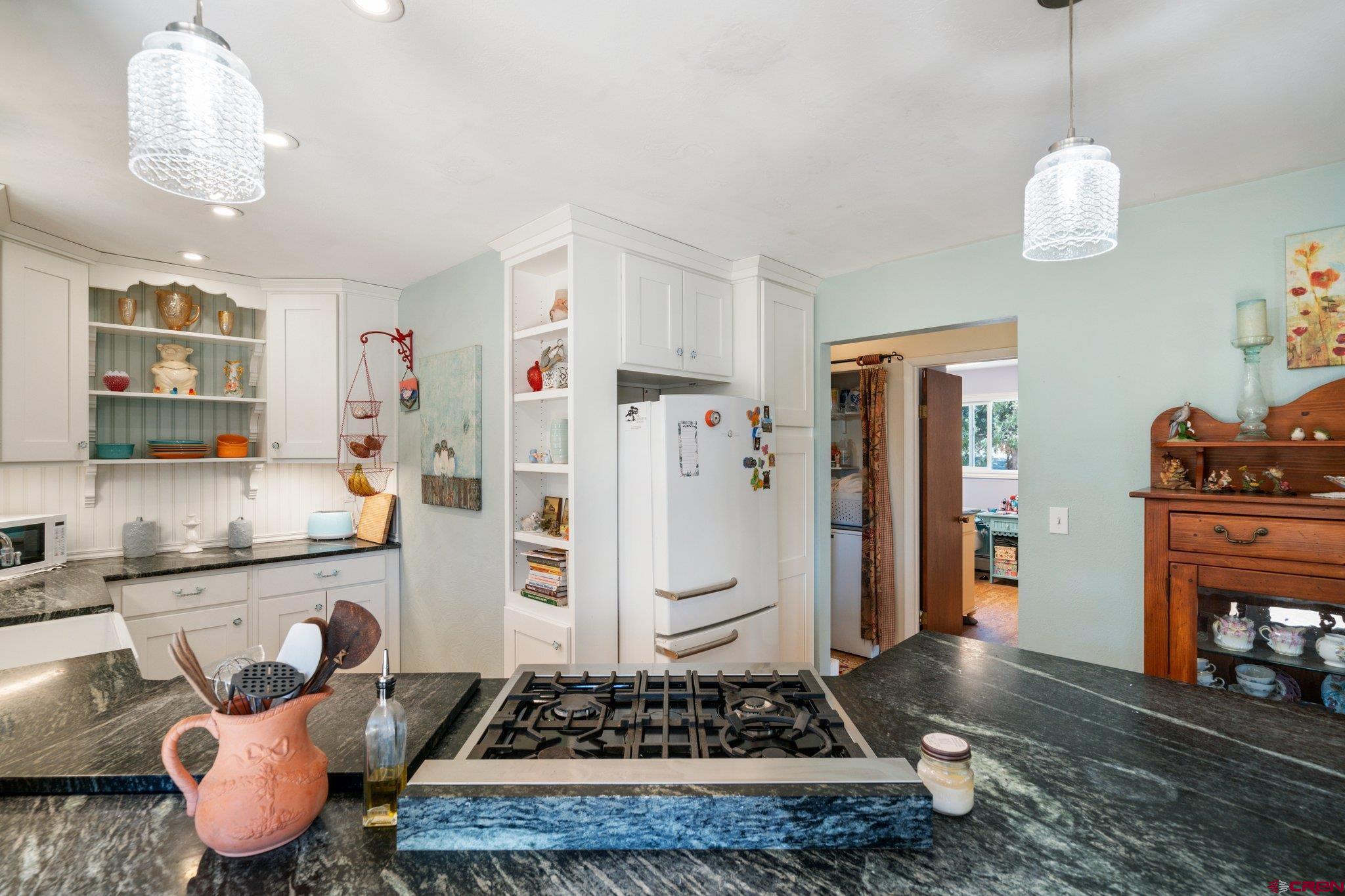 145 N Road Durango, CO 81303 - Photo 9 of 35 a kitchen with stainless steel appliances granite countertop a stove and a refrigerator
