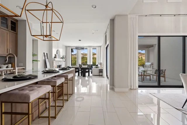 a bedroom with furniture and a large window