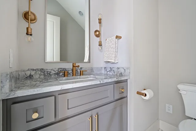 a view of a kitchen with a sink and a refrigerator